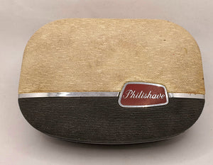 Vintage barbermaskin Philishave. Overside av oppbevaringsboks.
